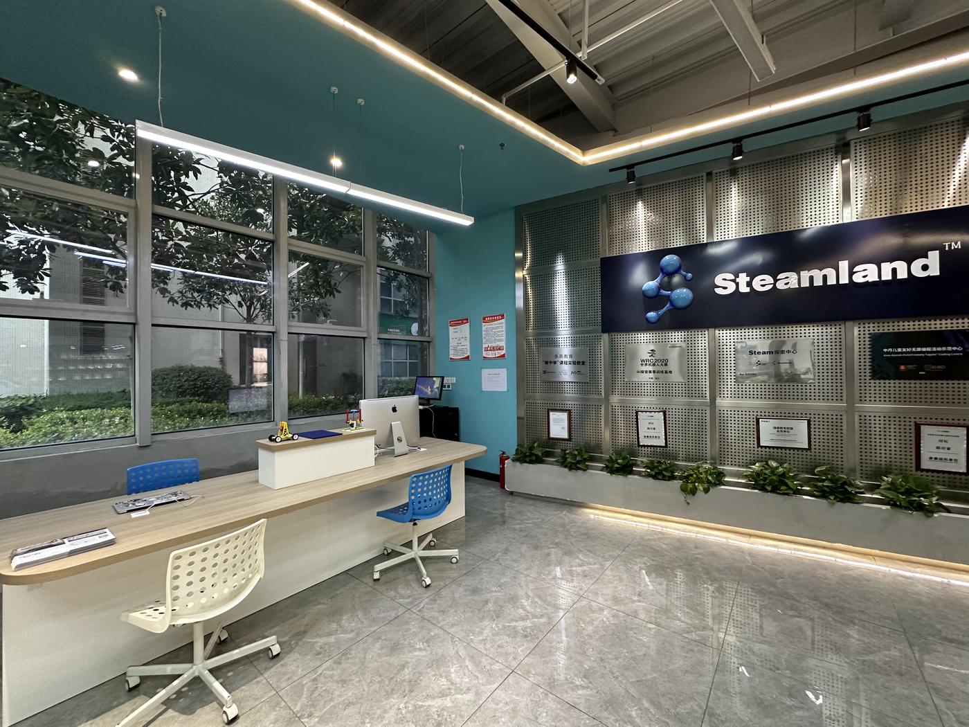 Reception desk with Steamland sign
